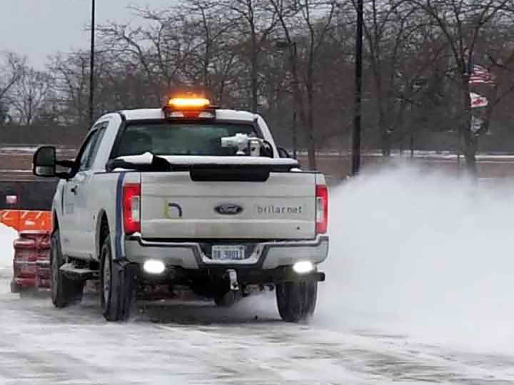 Photo of brilar truck clearing snow