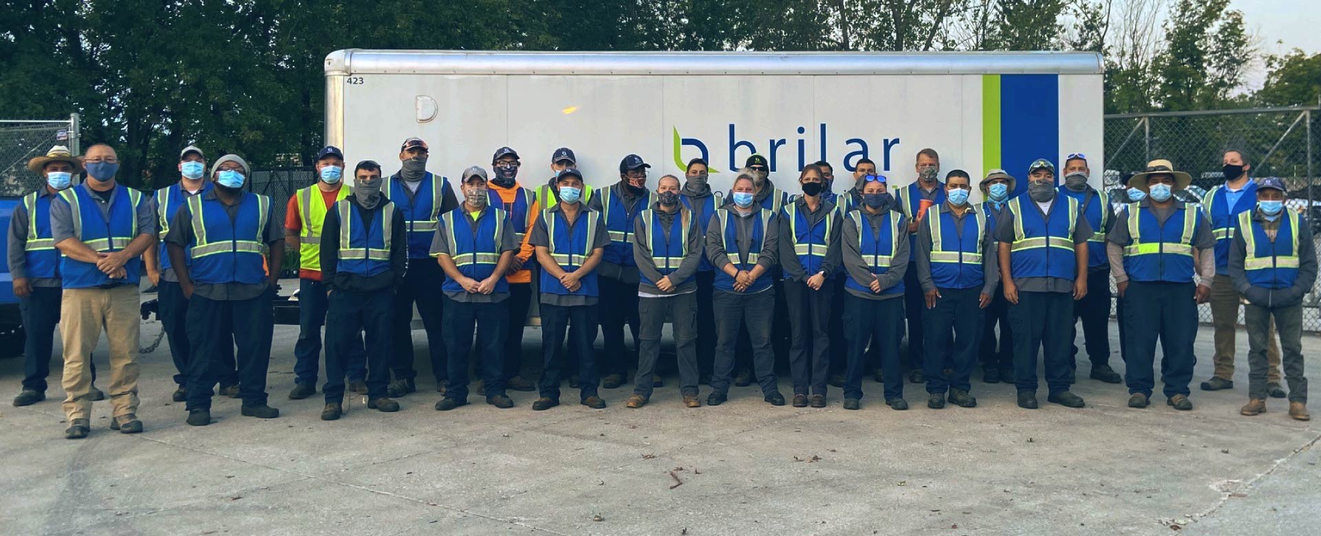 Photo of brilar employees in front of company truck
