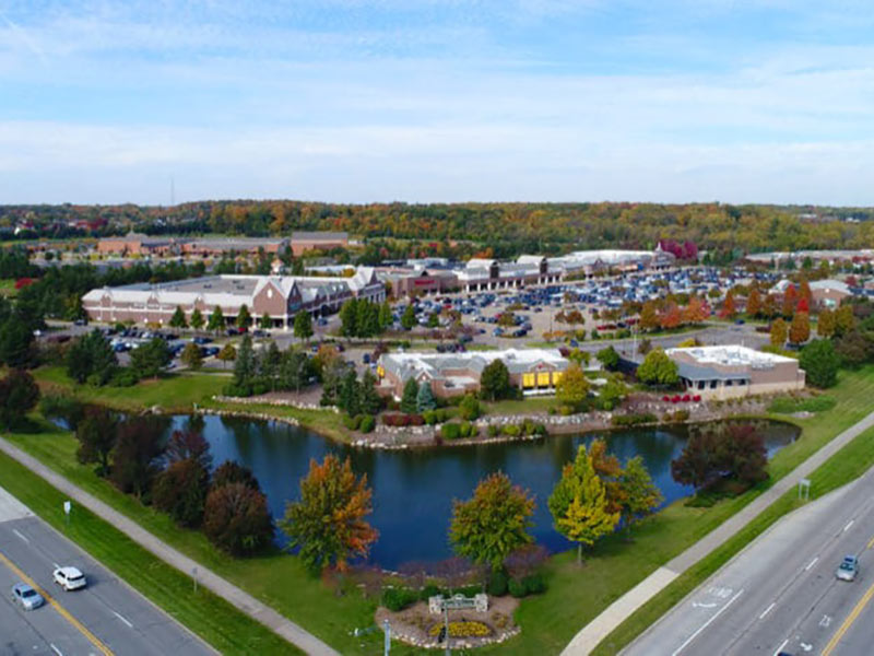 Photo of brilar tended landscaping with a lake, lawn, trees, flowers, and hedges for Grand Sakwa